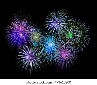 Explosive Colorful Green, Blue And Purple Fireworks Display In The Night Sky