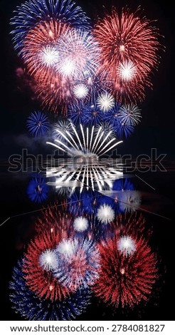 An explosive fireworks display illuminates a dark backdrop, creating dazzling visual effects. The composition features vibrant bursts of red, white, and blue, suggesting a celebratory event. The reflective surface below mirrors the spectacle. Suitable for illustrations related to festivities, celebrations, or general design projects.