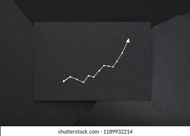 Exponential Graph. Growth Development Progress Concept. Arrow Going Up On Black Paper.