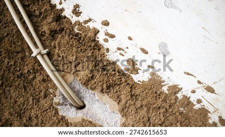 Exposed Electrical Conduits and Damaged Wall during Construction