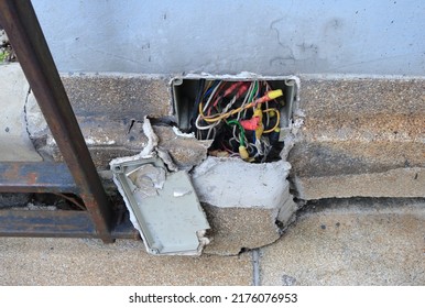 Exposed Electrical Wires Inside Junction Box In The Cracked Wall, High Angle View   