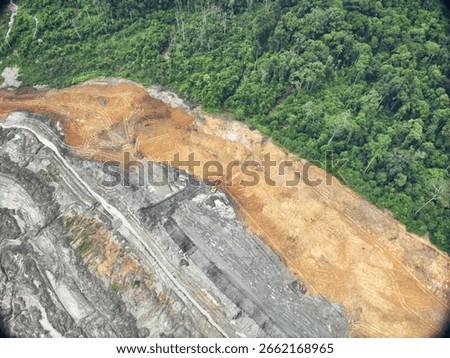 Exposed Red Soil Alongside Active Mining Area in Tropical Forest Edge