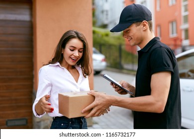 Express Delivery Service. Courier Delivering Package To Woman - Shutterstock ID 1165732177
