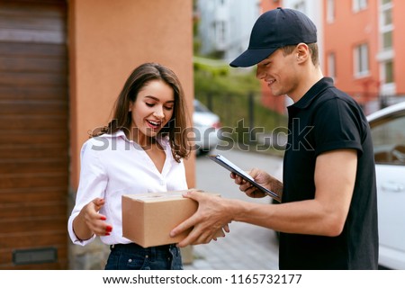 Express Delivery Service. Courier Delivering Package To Woman