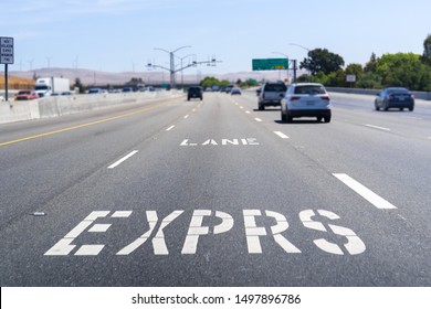 Express Lane marking on the freeway; San Francisco Bay Area, California; Express lanes help manage lane capacity by allowing single occupancy vehicles to use them for a fee - Shutterstock ID 1497896786