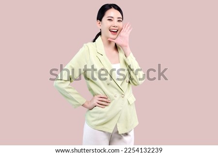 Expression Asian business female woman with open mouth raising hand screaming announcement good news and promotions isolated on pink background.