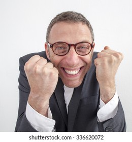 Expressive Corporate Man Concept - Sneaky Middle Age Businessman Expressing Success And Energy With Humor,wide Angle On White Background