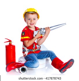 Expressive cute toddler boy with fireman's outfit on. Isolated on the white background