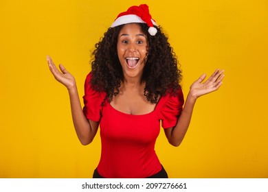 Expressive Excited Woman with Santa Hat on Yellow Background. - Powered by Shutterstock