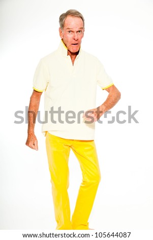 Expressive good looking senior man casual  summer dressed against white wall. Happy, funny and characteristic. Isolated. Studio shot.