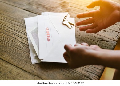 Expressive Hands React To An Overdue Letter In An Envelope - Financial Hardship - Crisis