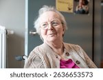Expressive portrait of an 86 yo grandmother sitting in a wheelchair home in Tienen, Flemish Brabant, Belgium 1 June 2025 Model released