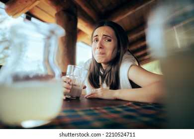
Expressive Woman Tasting a Sour Lemonade in a Restaurant. Funny girl drinking a citrus juice making a crinkled face
 - Shutterstock ID 2210524711