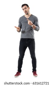 Expressive Young Casual Man Explaining And Gesticulating With Hands. Full Body Length Portrait Isolated Over White Studio Background.