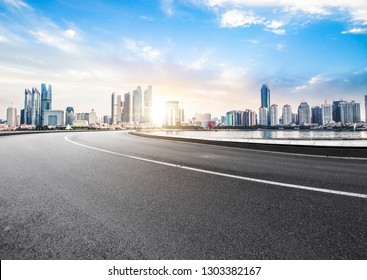 The Expressway And The Modern City Skyline Are In Chongqing, China.