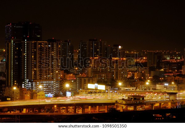 Expressway pay toll with hi-rise condominiums\
background in Bangkok,\
Thailand