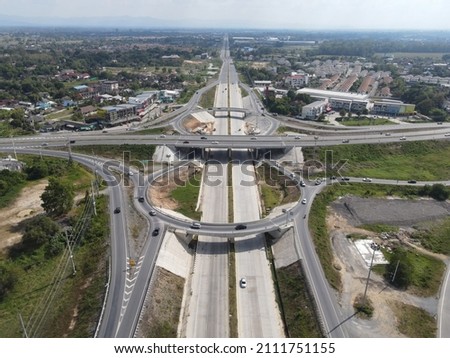 expressway , throughway, superhighway or motorway, major arterial divided highway that features two or more traffic lanes in each direction