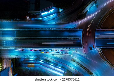 Expressway top view, Road traffic an important infrastructure,car traffic transportation above intersection road in city night, aerial view cityscape of advanced innovation, financial technology	