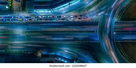 Expressway top view, Road traffic an important infrastructure, car traffic transportation above intersection road in city night, aerial view cityscape of advanced innovation, financial technology	
				