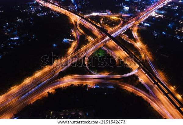 Expressway top view, Road traffic an important\
infrastructure, car traffic transportation above intersection road\
in city night, aerial\
view
