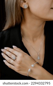an exquisite beautiful gift for beautiful women an expensive set of Italian jewelry made of 18 karat white gold, consisting of earrings, a bracelet, a pendant and a ring with diamonds