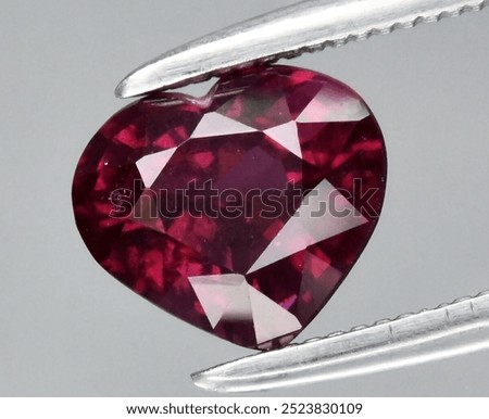 Exquisite Heart-Shaped Ruby Gemstone Captured in Brilliant Detail.