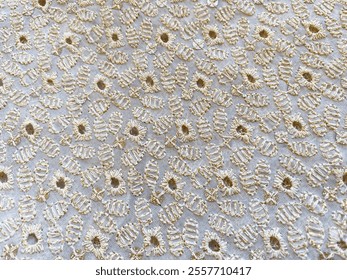 An exquisite off-white georgette fabric adorned with intricate light gold Lucknowi embroidery, creating a timeless blend of sophistication and delicate craftsmanship, ideal for elegant ensembles. - Powered by Shutterstock