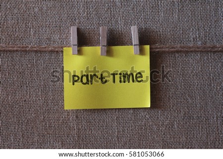 ext on a yellow sticky note with three clips