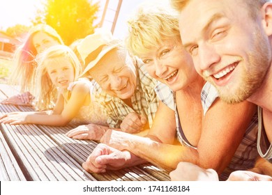 Extended Family With Children And Grandparents Together On Summer Vacation