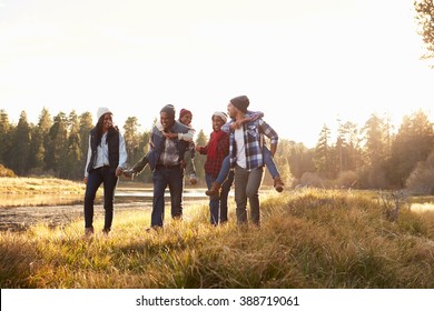 Extended Family Group Walking By Lake