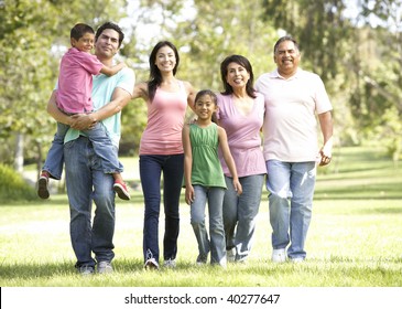 Extended Family Group Walking In Park