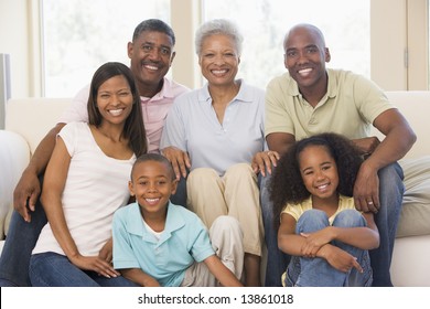 Extended Family In Living Room Smiling