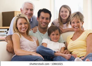 Extended Family In Living Room Smiling