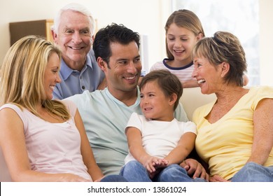 Extended Family In Living Room Smiling