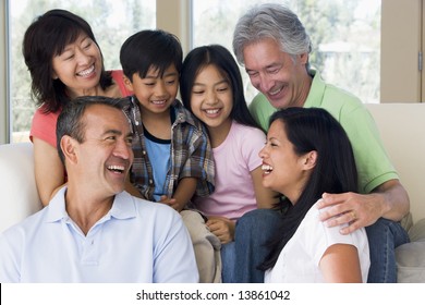 Extended Family In Living Room Smiling