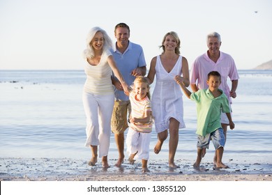 Extended Family Walking On Beach