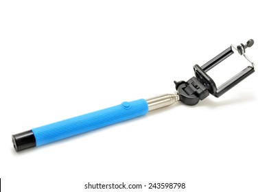 an extensible selfie stick with an adjustable clamp on the end on a white background