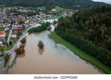 Extensive deluge across Europe, flooded mountain valley, near the households area and traffic ways, drone shot. Extreme climate event. - Shutterstock ID 2229992685