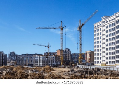 Extensive Scaffolding Providing Platforms For Work In Progress On A New Apartment Block,Tall Building Under Construction With Scaffolds,Freestanding Tower Crane On A Building Site