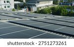 Extensive solar panel array is harnessing renewable energy on a commercial factory roof, focusing on sustainable business practices, eco-friendly infrastructure, and carbon footprint reduction.