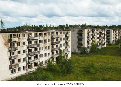 Exterior Of An Abandoned Apartment Buildings With Broken Windows In A Desolate European Ghost Town.