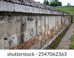 The exterior of an ancient Hindu building that functions as a sacrificial temple called the Sambisari temple