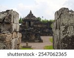 The exterior of an ancient Hindu building that functions as a sacrificial temple called the Sambisari temple