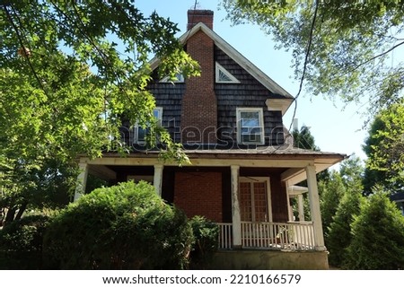 Exterior of a beautiful abandoned home in the summer season.                                