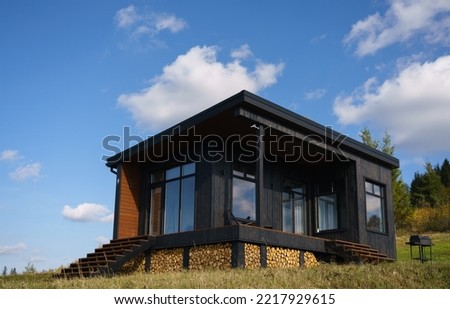 exterior of a black modern wooden cabin