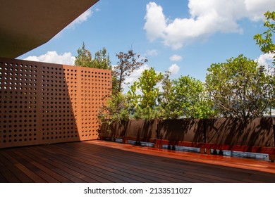 Exterior contemporary apartment terrace with ipe hardwood decking and outdoor privacy greens plantings for balconies 