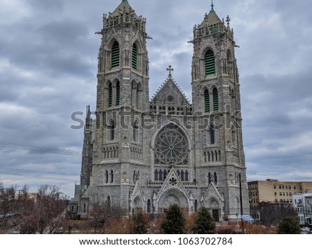 Exterior daytime stock photo of stone masonry Cathedral Basilica of the Sacred Heart in Newark, New Jersey on overcast cloudy day in Essex County