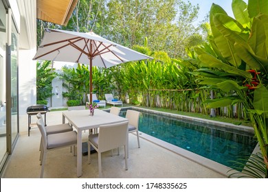 Exterior Design In Luxury Pool Villa Feature Pool Terrace, Garden Landscape, Outdoor Dining Table, BBQ, Dining Chair And Umbrella