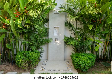 Exterior Design Of Outdoor Shower In Garden Of Luxury Pool Villa, House, Home Feature Rain Shower Head And Garden Landscape