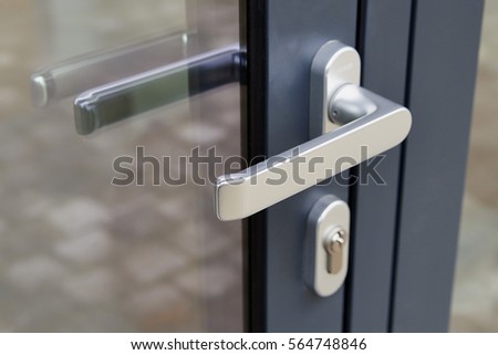 Exterior door handle and Security lock on Metal frame - Low deep of field